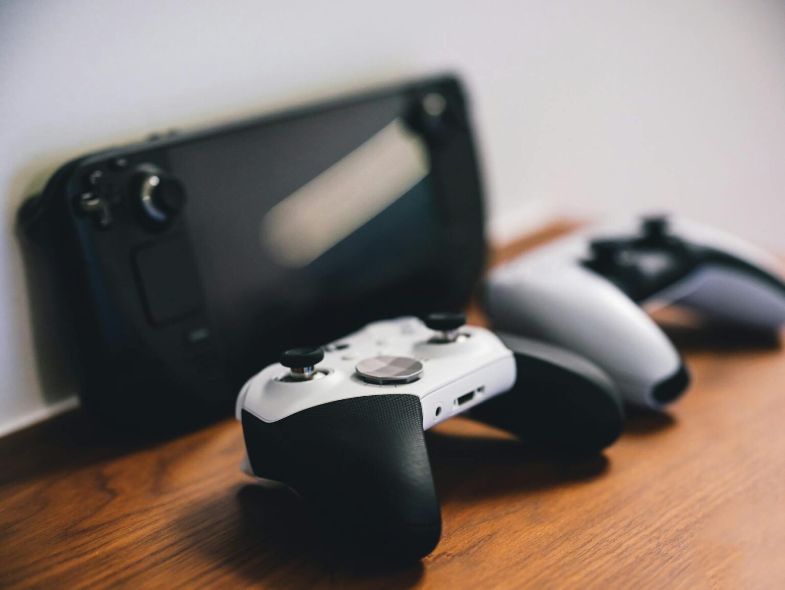 Modern gaming console with controller on entertainment center