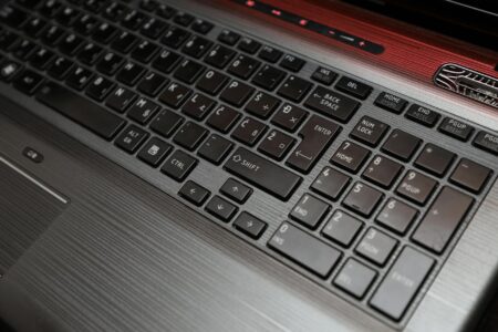 Close-up view of modern laptop keyboard and trackpad showing sleek design
