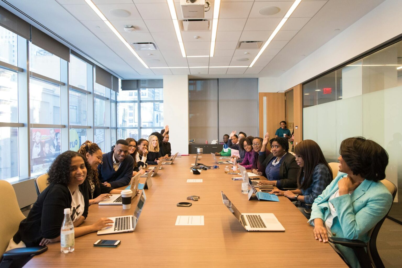 Why Enterprise Companies Are Ditching Slack for Open-Source Communication Tools Business professionals collaborating in modern office meeting room