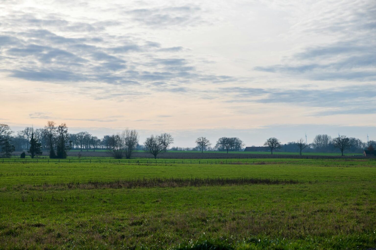 How Satellite Internet Is Finally Reaching Rural Smartphone Users Person holding smartphone in rural mountainous landscape searching for cellular signal