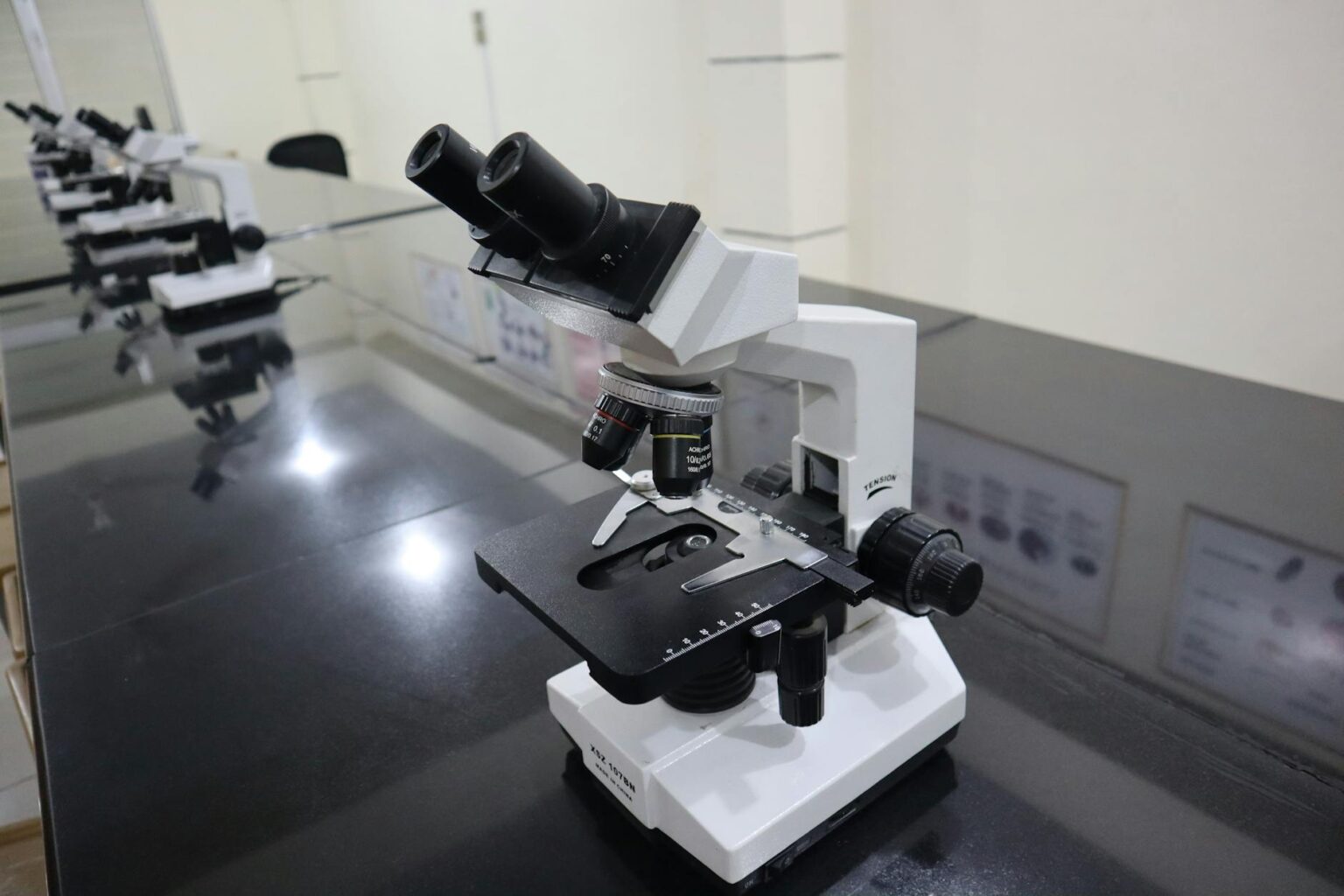 Why CRISPR Gene Editing Tools Are Moving from Labs to Agricultural Fields Scientist using microscope in modern laboratory for genetic research