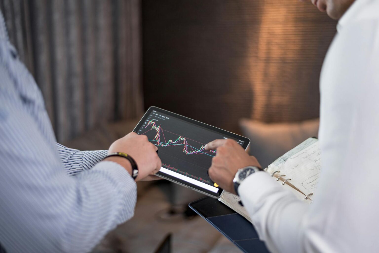 How Foldable Tablets Are Replacing Traditional Laptops for Business Users Professional using tablet device at modern office desk with documents