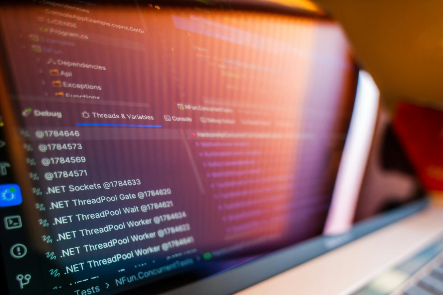 How Browser-Based Code Editors Are Replacing Visual Studio for Remote Development Developer working on code displayed on laptop screen with modern development environment