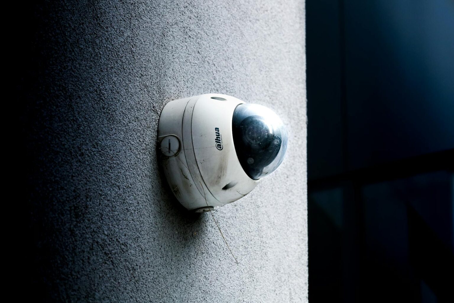 Why Smart Home Security Systems Are Adding Package Theft Prevention Modern smart security camera mounted near residential front door entrance