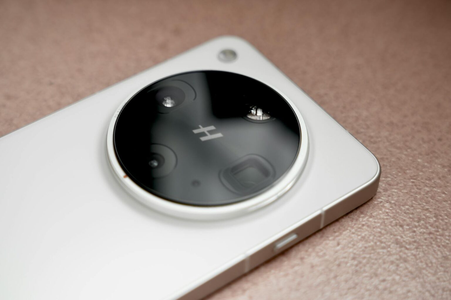 Why Samsung Galaxy Phones Are Adding Physical Camera Shutter Buttons Like iPhones Close-up view of smartphone showing physical camera button on side edge