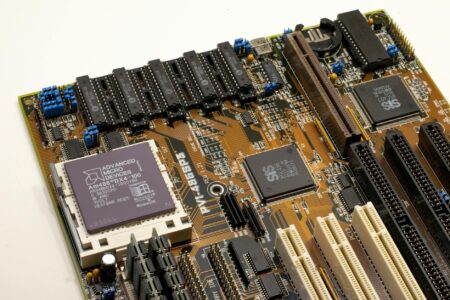 Close-up view of a modern computer processor chip on a circuit board showing advanced semiconductor technology
