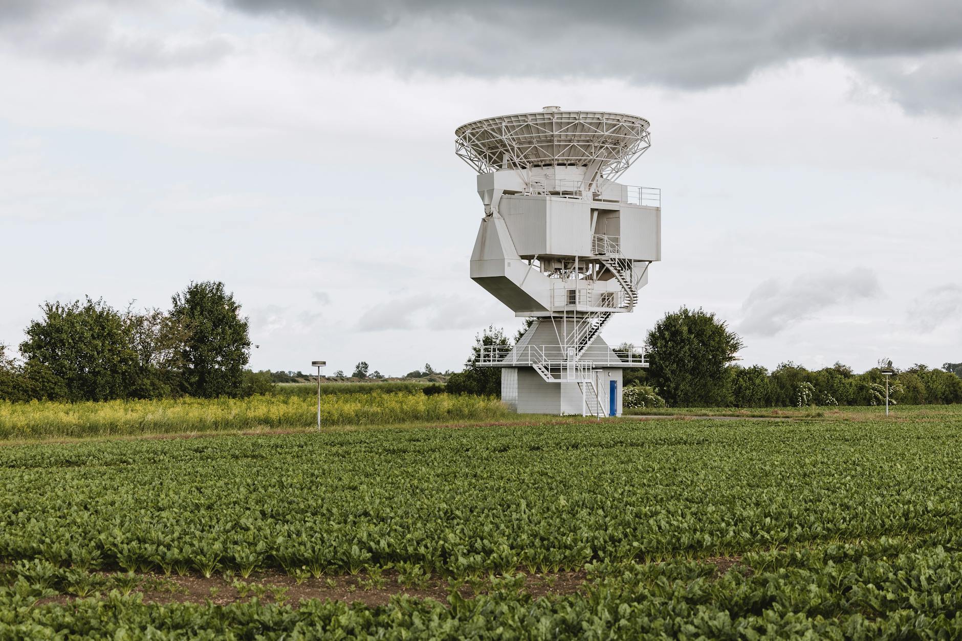 Weather monitoring equipment and satellite dish for atmospheric data collection
