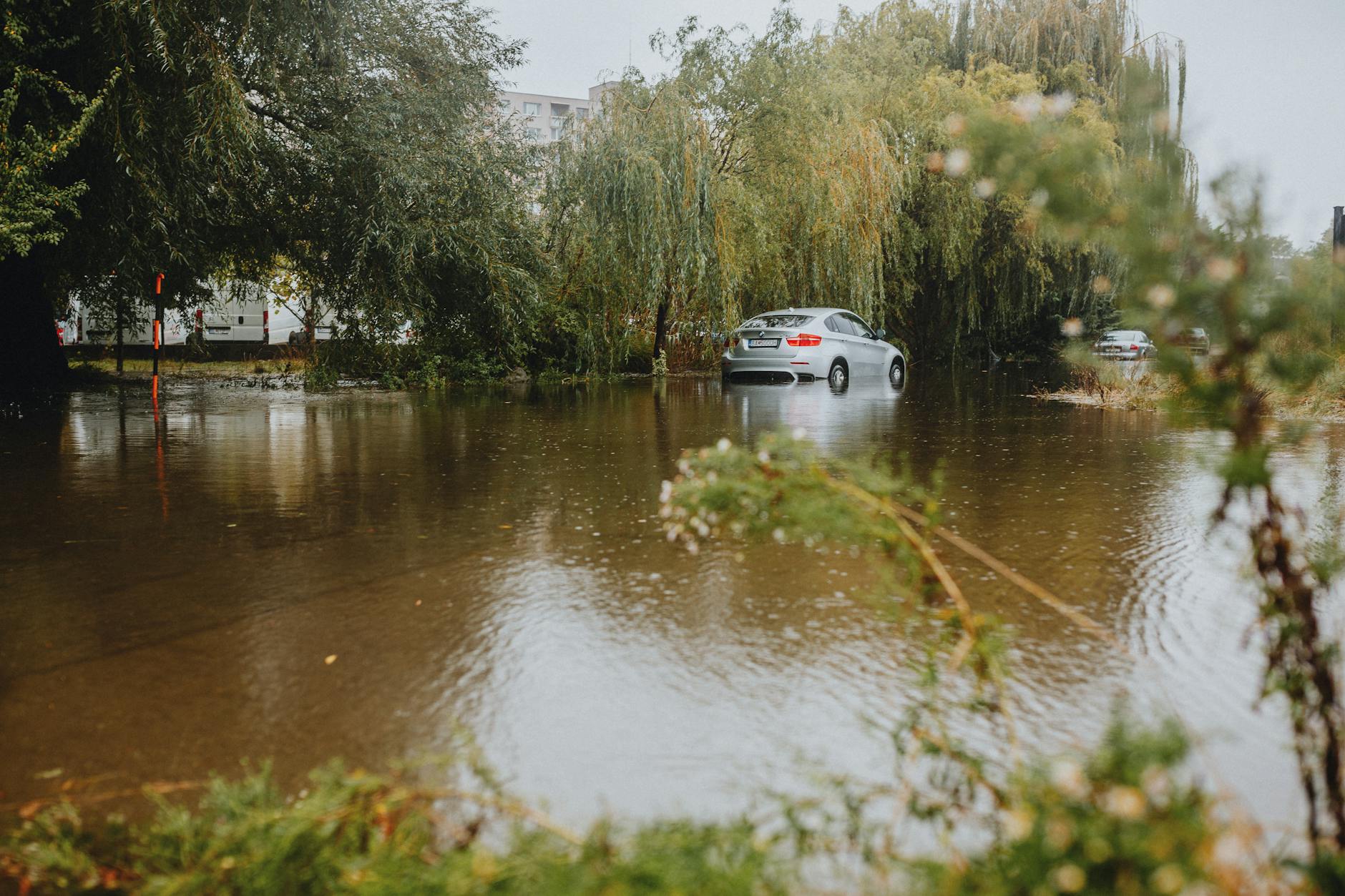 Aerial view of urban flooding with water covering streets and buildings partially submerged
