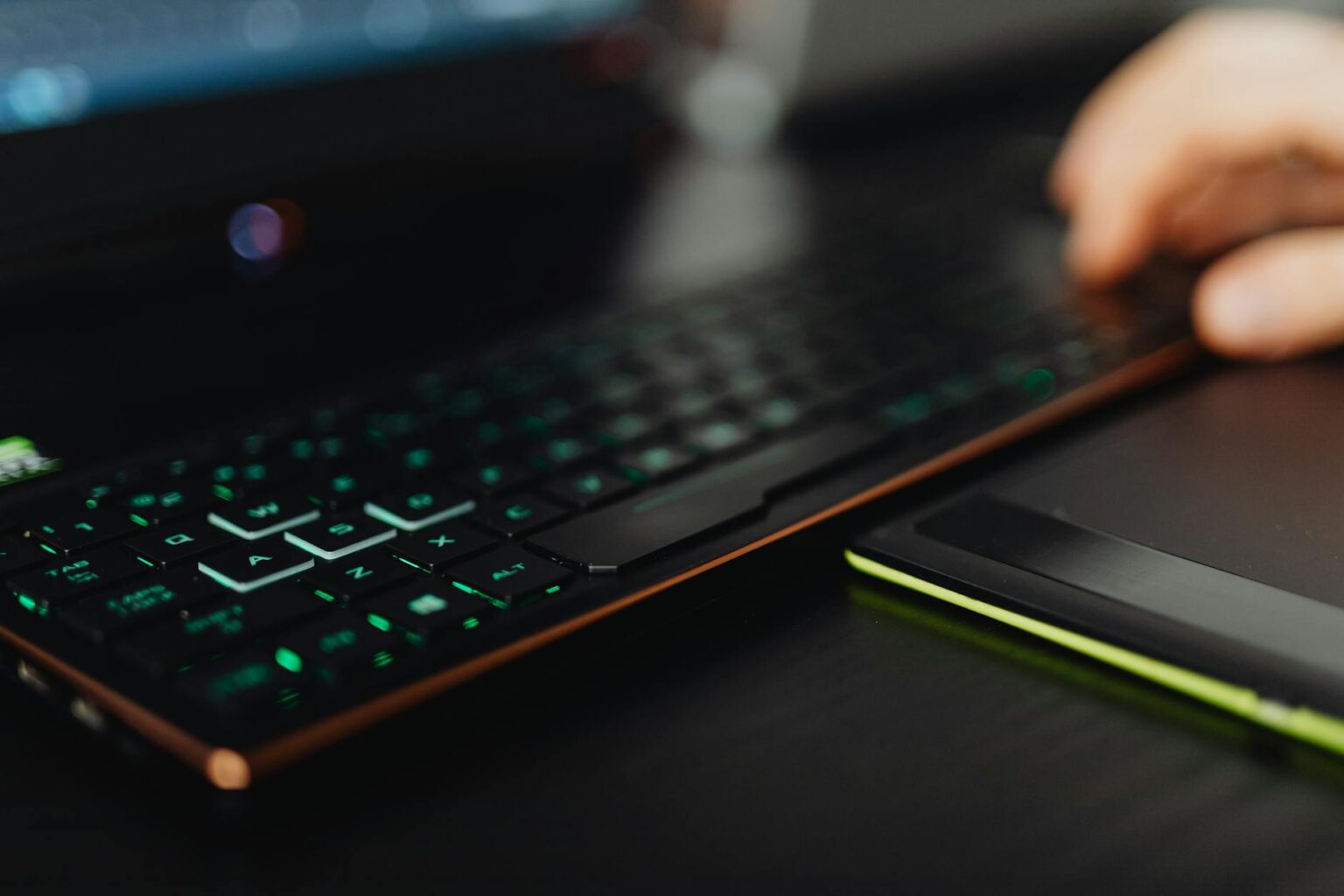 Valve’s Proton Compatibility Layer Is Quietly Killing Windows-Only Game Deals A gaming laptop on a desk representing PC gaming platform choices