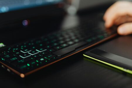 A gaming laptop on a desk representing PC gaming platform choices