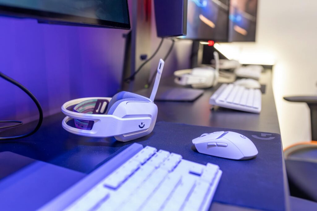 A competitive gaming setup with multiple monitors and peripherals representing ranked online play