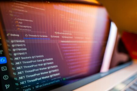 Computer monitor displaying programming code with syntax highlighting