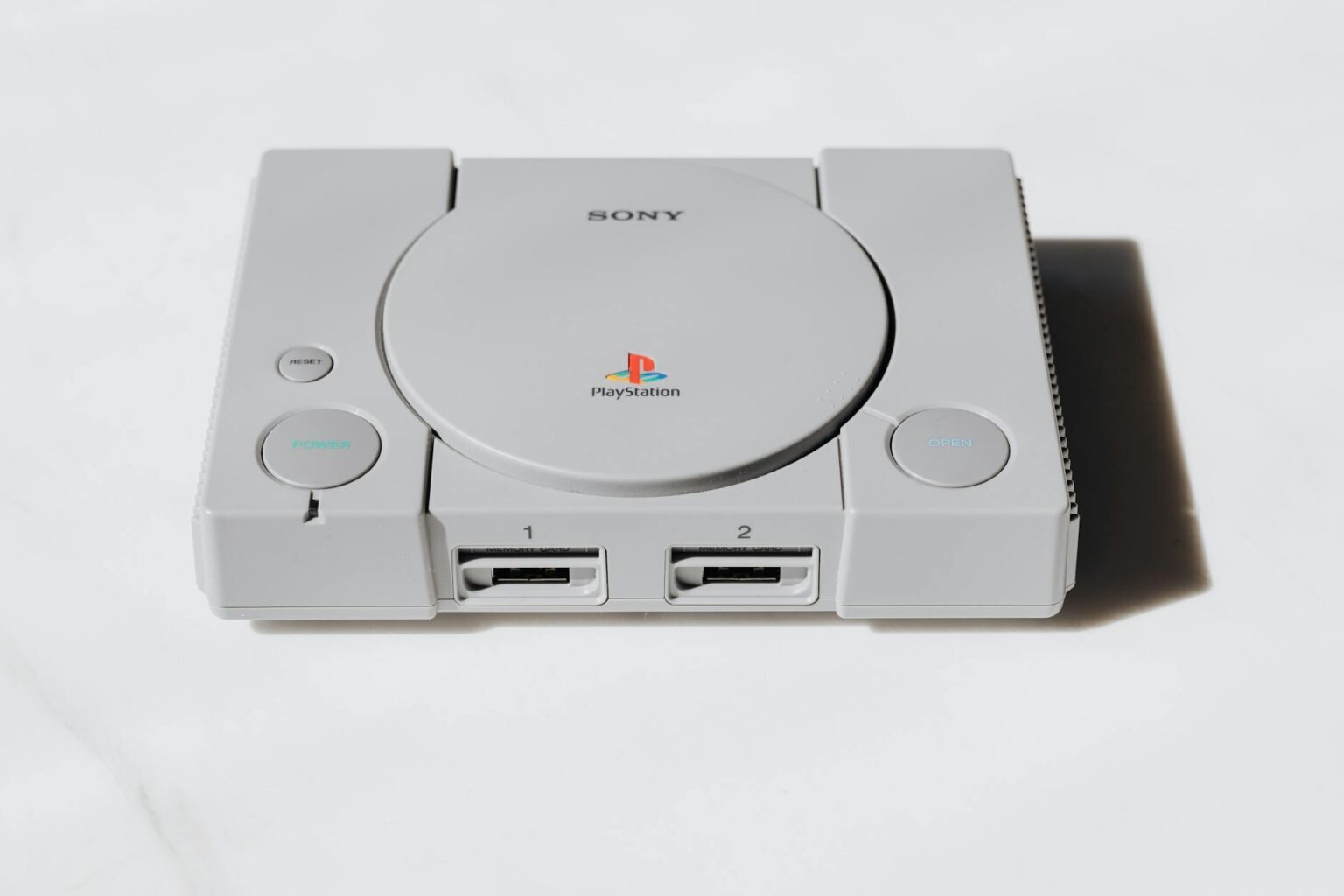 Nintendo’s Handheld Dominance Is Pushing Sony Back Into Portable Consoles Modern gaming console with controller on entertainment center