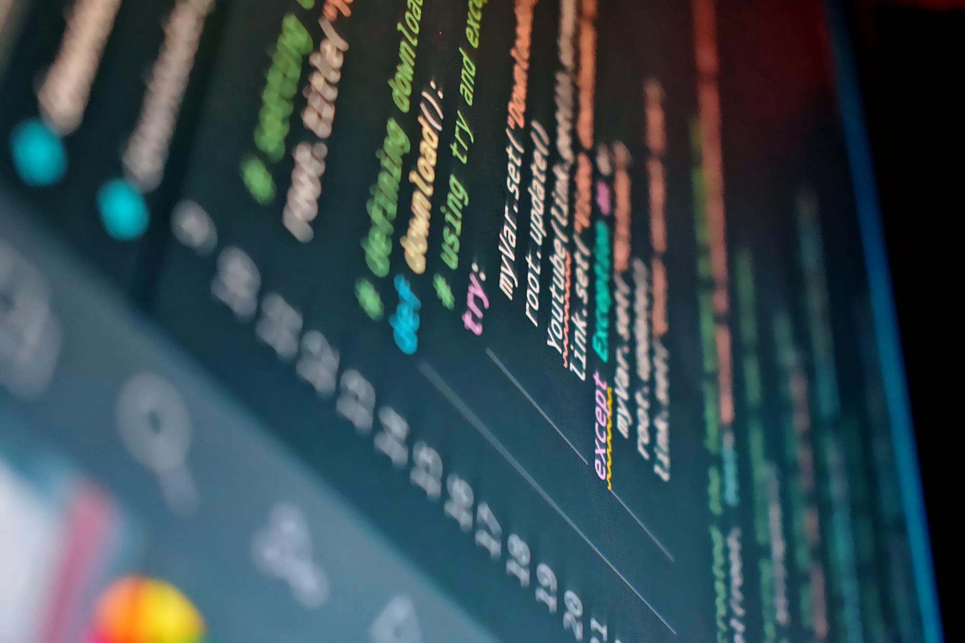 Close-up view of programming code on a computer screen showing database development work