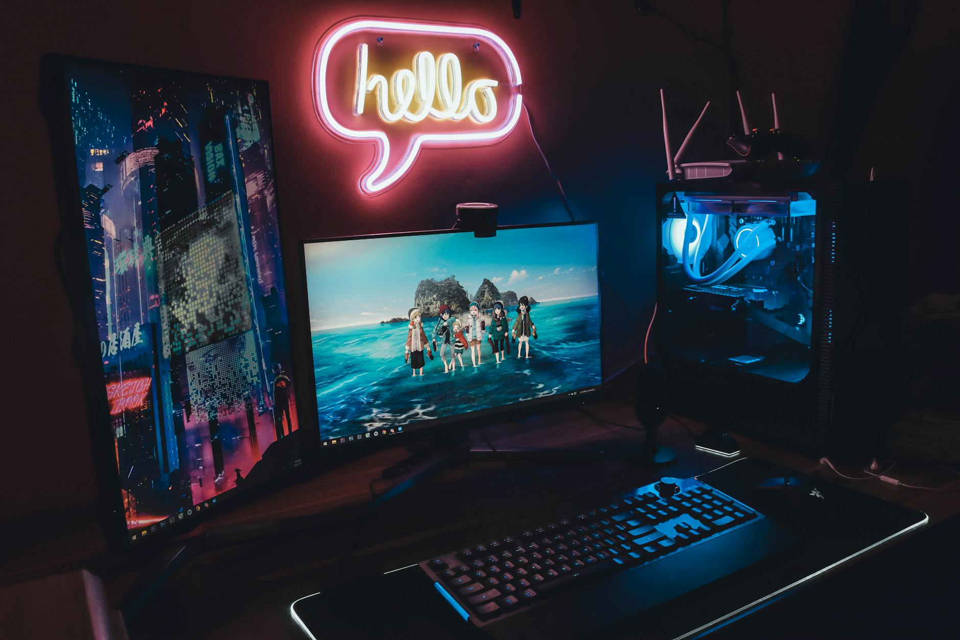 Gaming computer setup with multiple monitors displaying game graphics