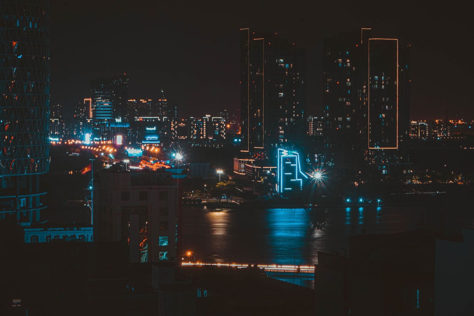 Rockstar’s GTA VI Trailer Hype Is Dragging Players Back to Vice City Neon-lit city street at night evoking a retro Miami aesthetic