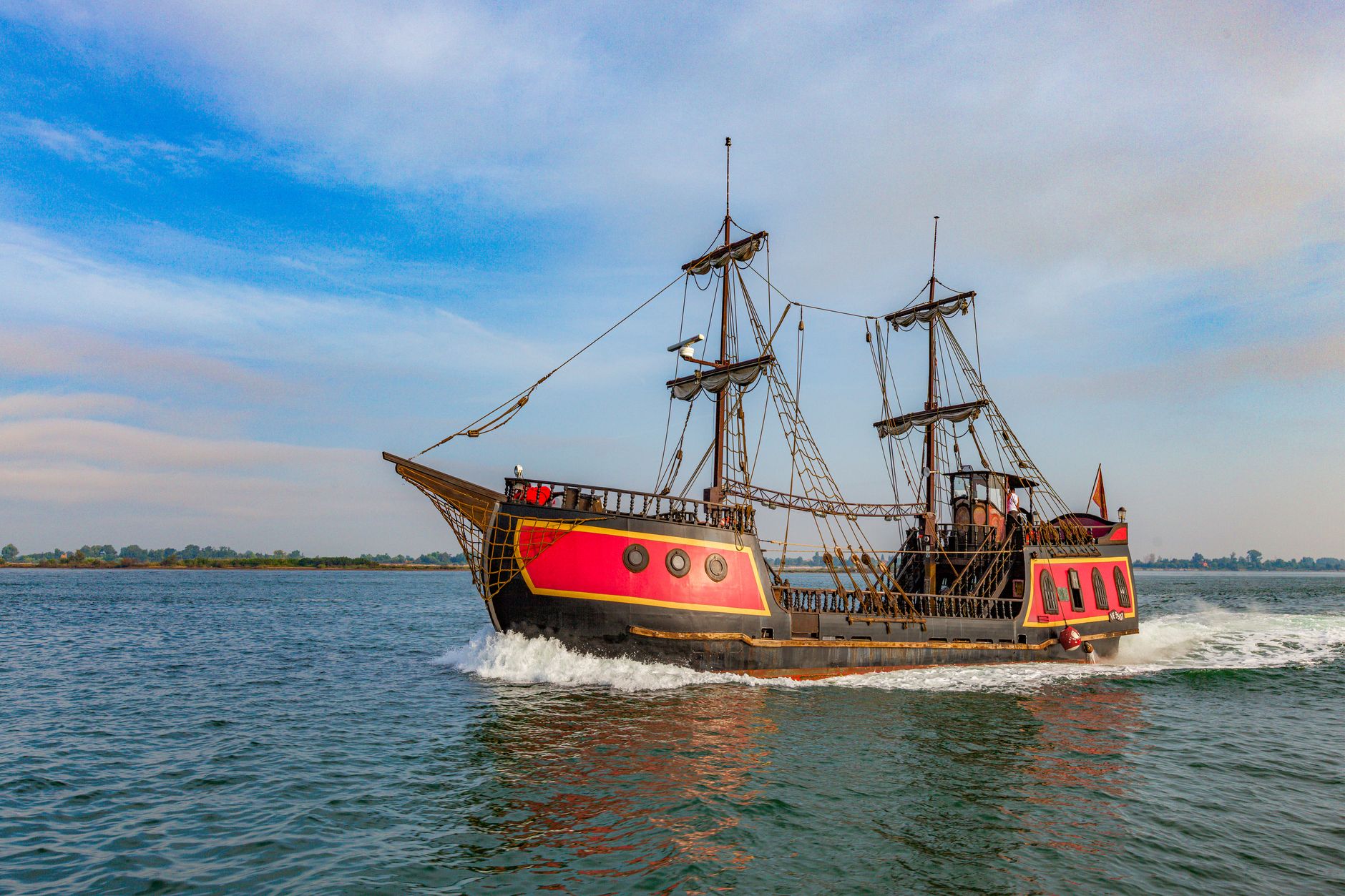 A tall ship sailing on open ocean, evoking the pirate setting of Assassin's Creed Black Flag