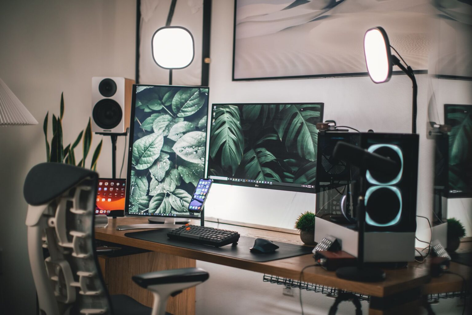 A gaming PC setup with a monitor displaying a competitive multiplayer game