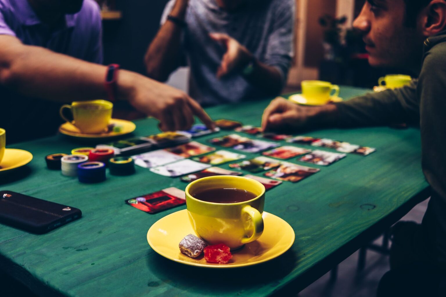 A complex strategy board game spread across a table, representing grand strategy gameplay decisions