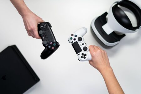 Arrowhead’s Helldivers 2 Patch Rollbacks Are Fracturing Its Community Trust A game controller resting on a desk representing player frustration with game updates