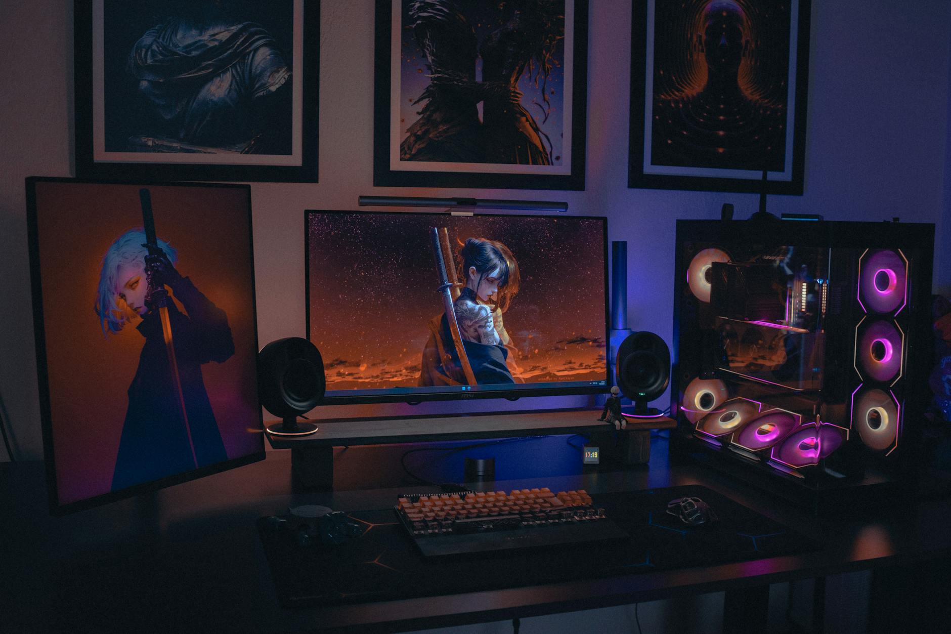 A gaming PC setup with multiple monitors displaying a colorful open-world survival game environment