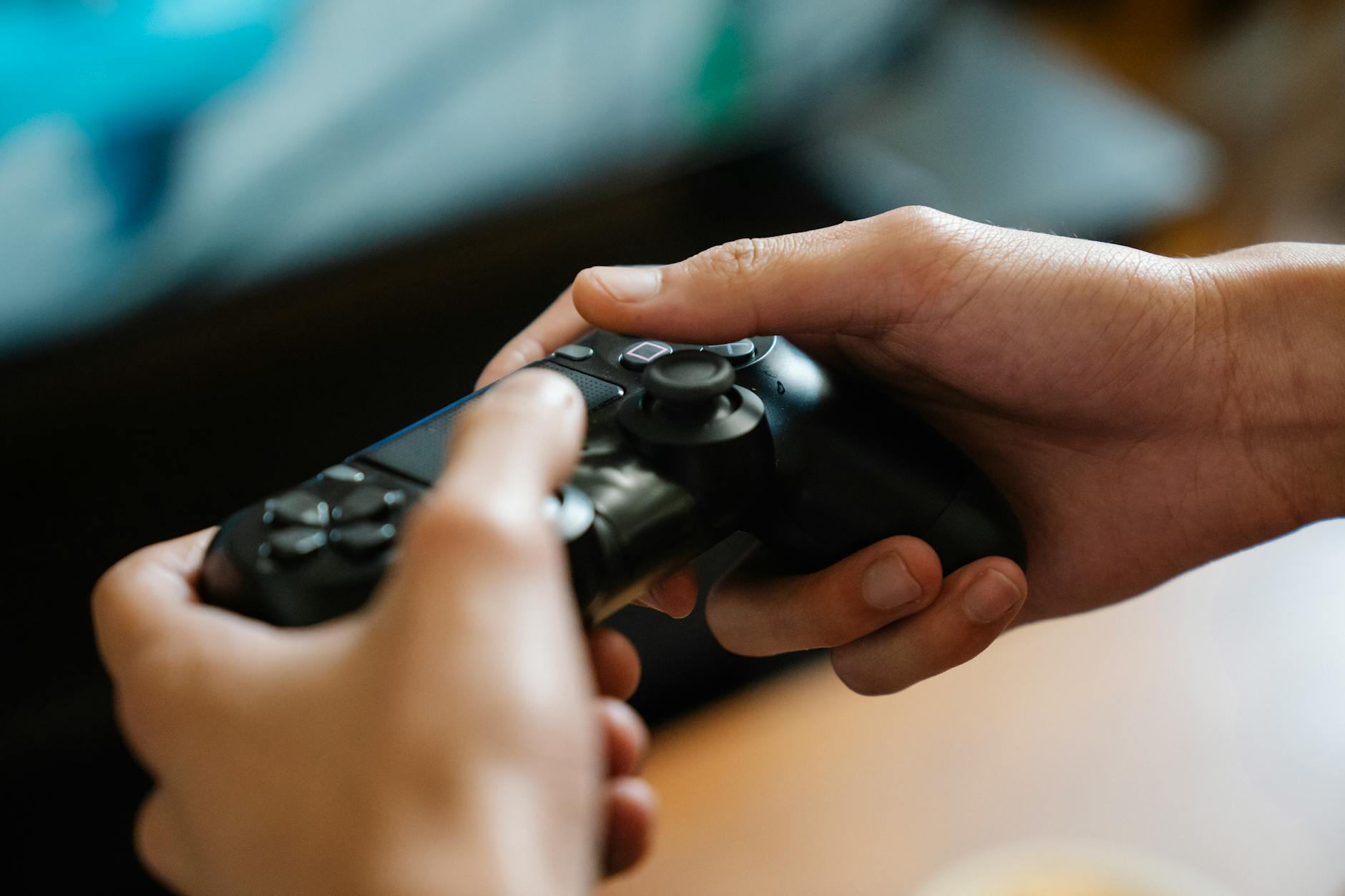 A person playing a video game on a television in a dark room