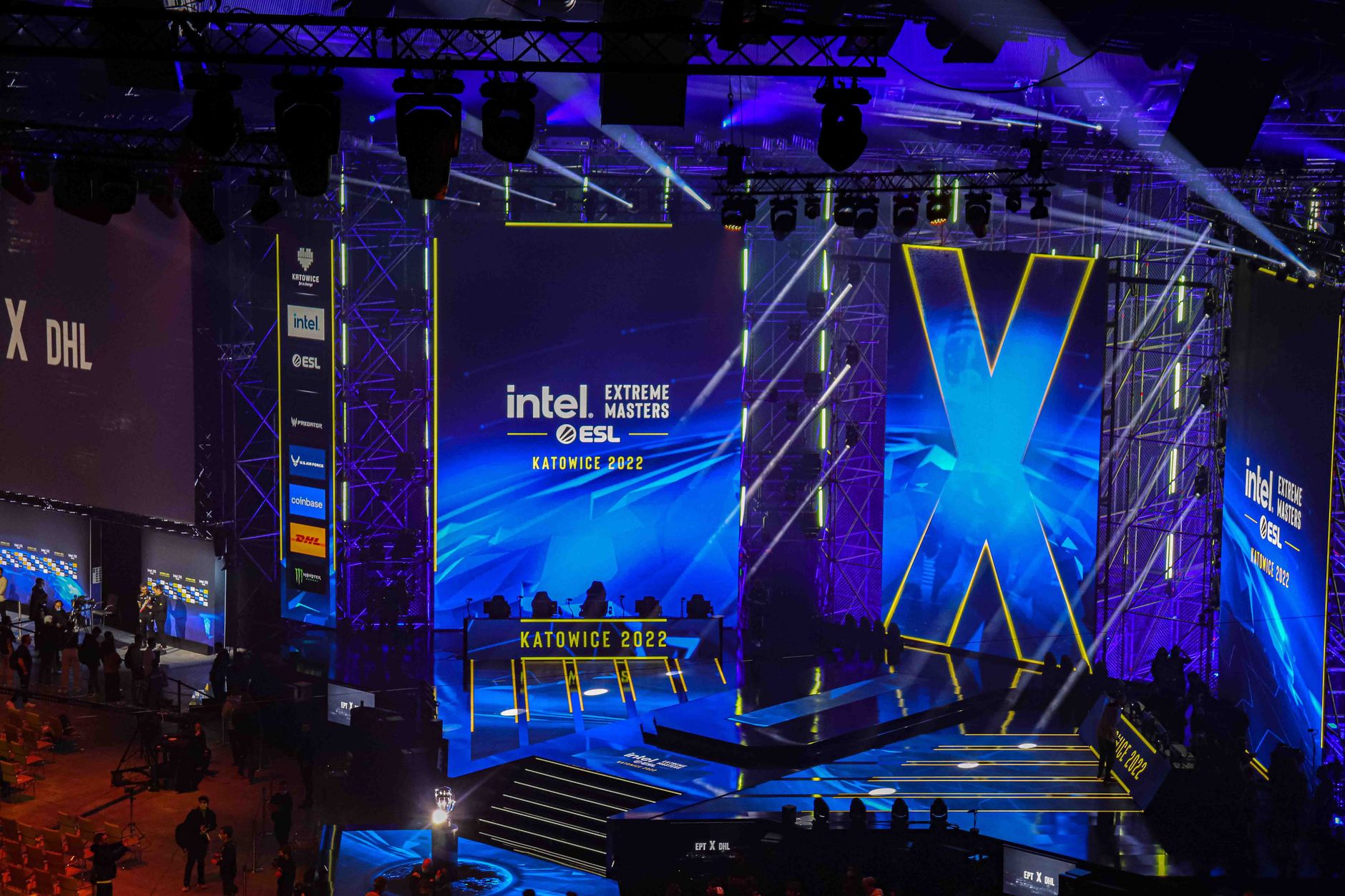 A competitive esports arena with players and audience watching a live tournament