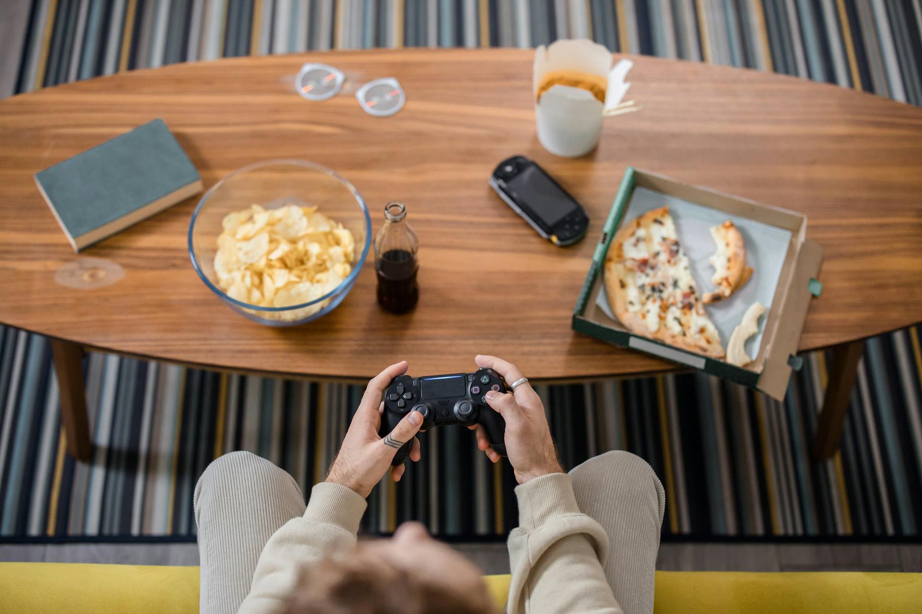A person playing a console video game, representing fans engaging with platformer titles