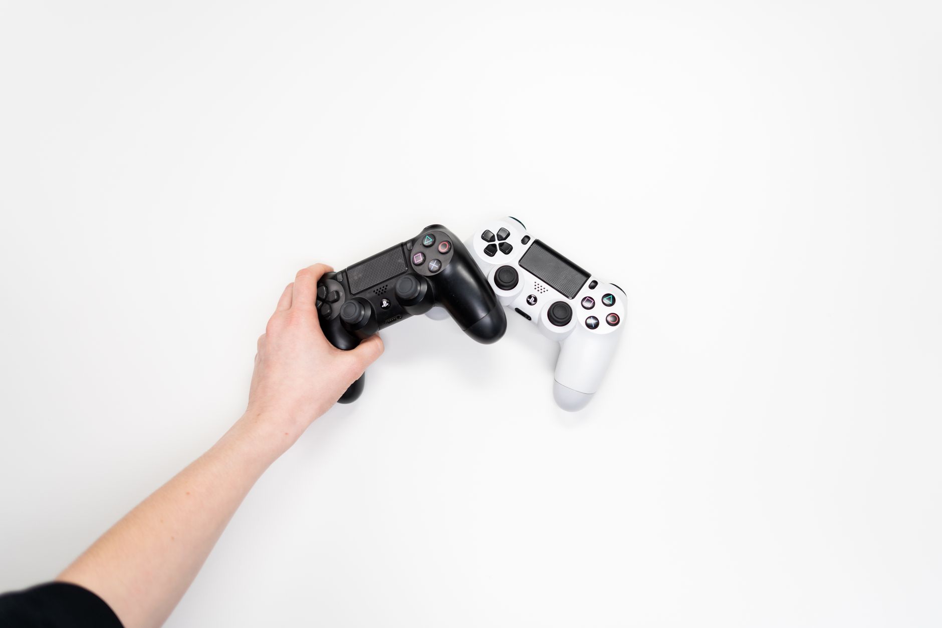 Close-up of a gamer holding a controller during competitive play