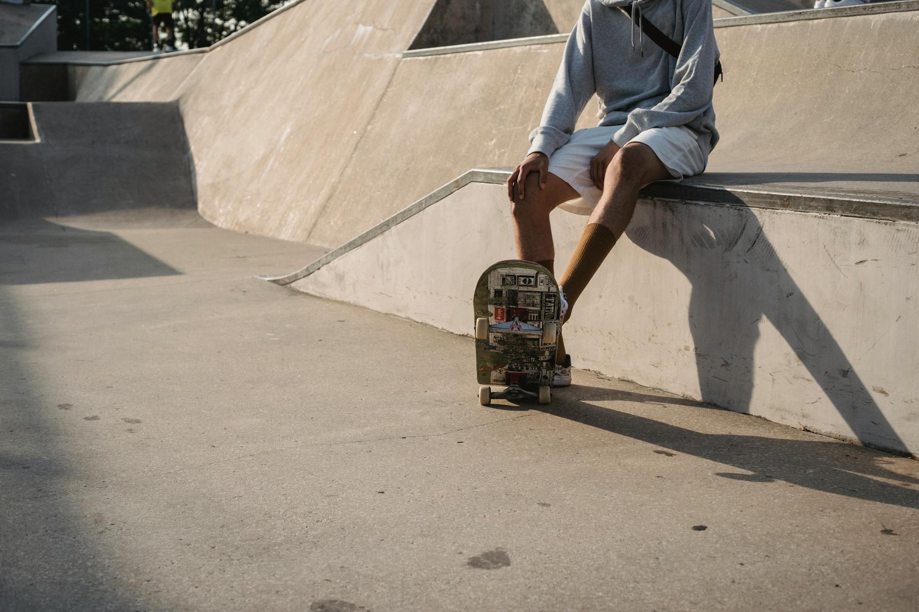 A skateboarder riding through an urban street environment