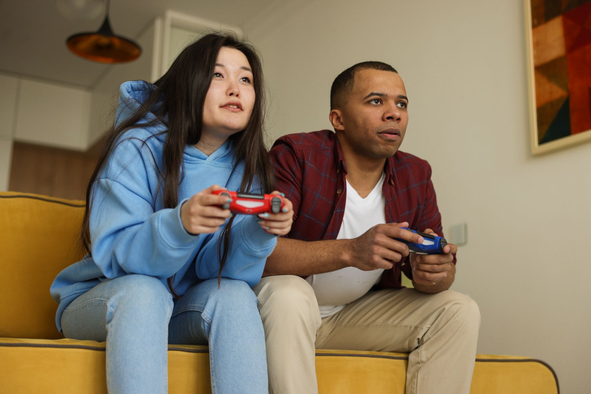 Person gaming on a console in a living room setting