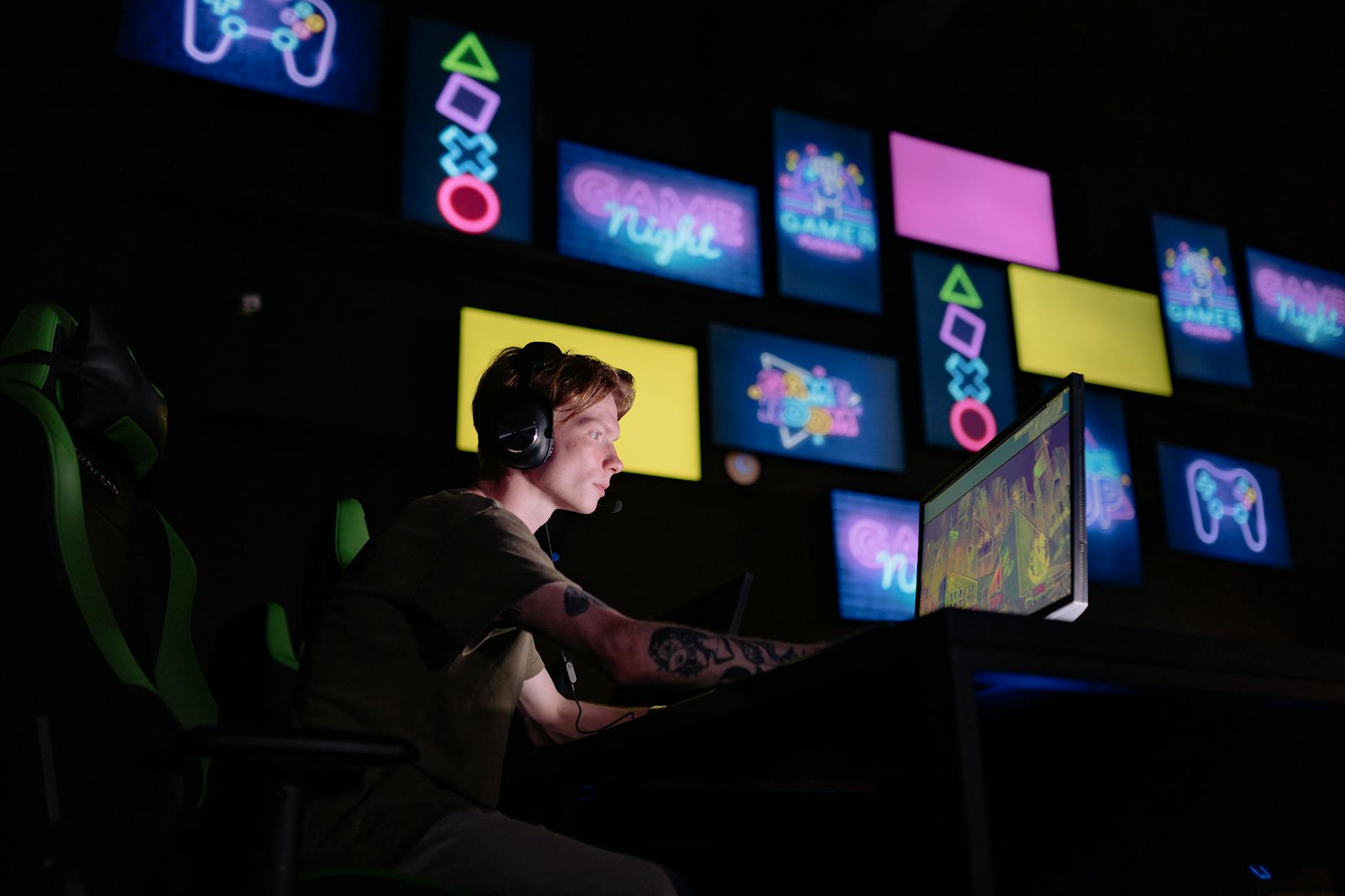 A person engaged in an immersive gaming session on a PC, face lit by the monitor glow