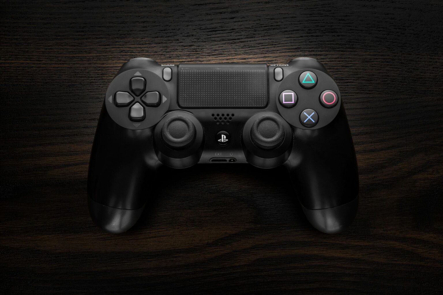 Xbox’s Indiana Jones Success Is Quietly Rehabilitating Bethesda’s Reputation A game controller resting on a dark surface representing Xbox gaming culture