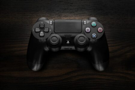 Xbox’s Indiana Jones Success Is Quietly Rehabilitating Bethesda’s Reputation A game controller resting on a dark surface representing Xbox gaming culture
