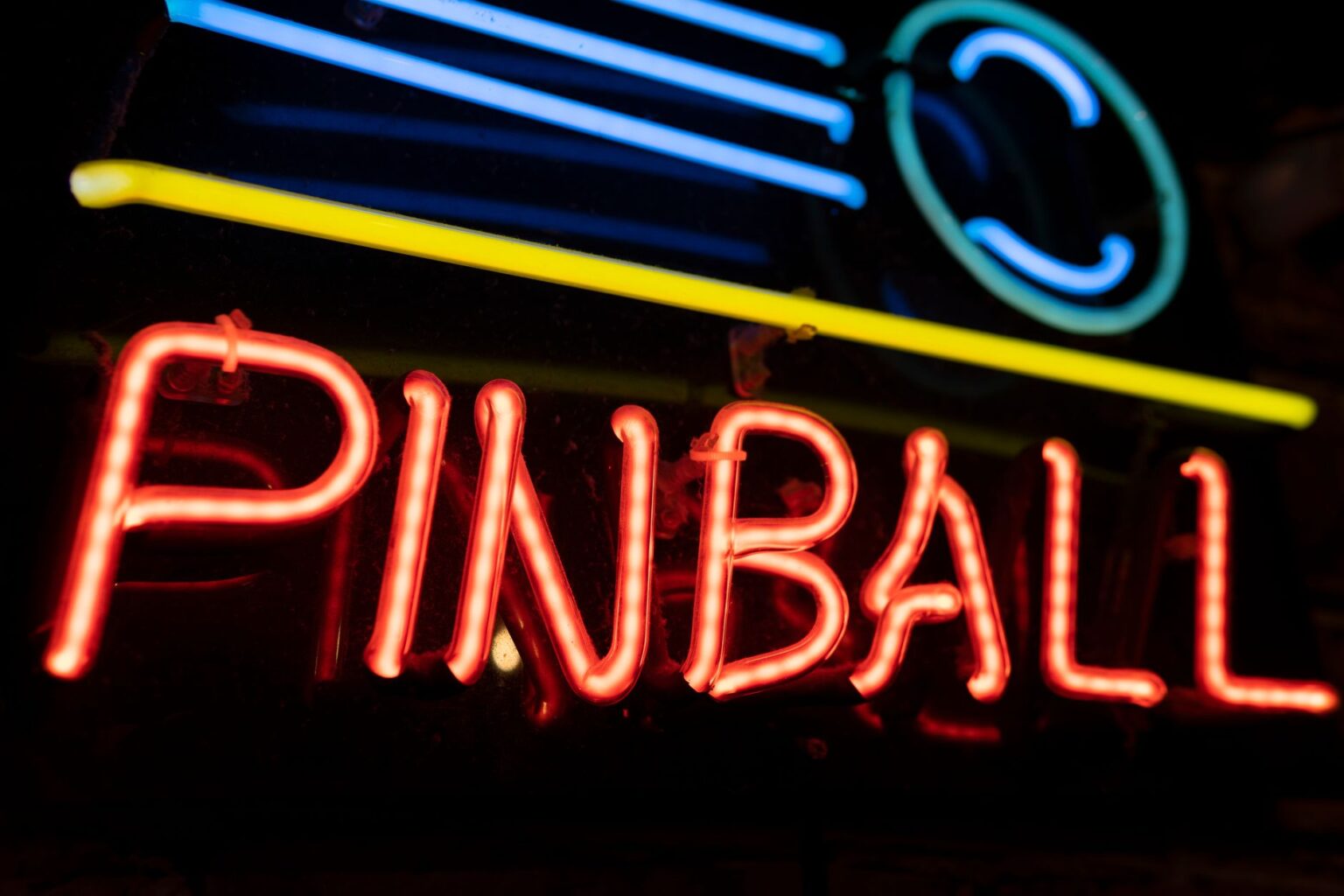 Neon-lit arcade gaming setup representing retro game nostalgia and player engagement