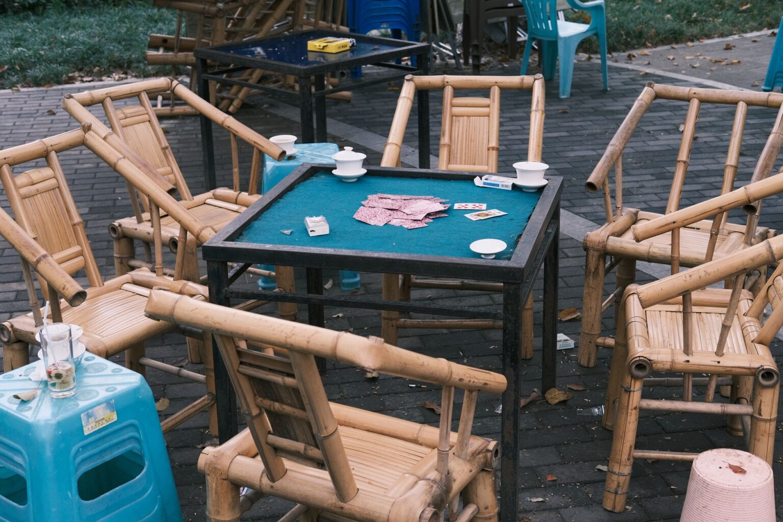 Physical trading cards spread across a game table representing strategic card gameplay