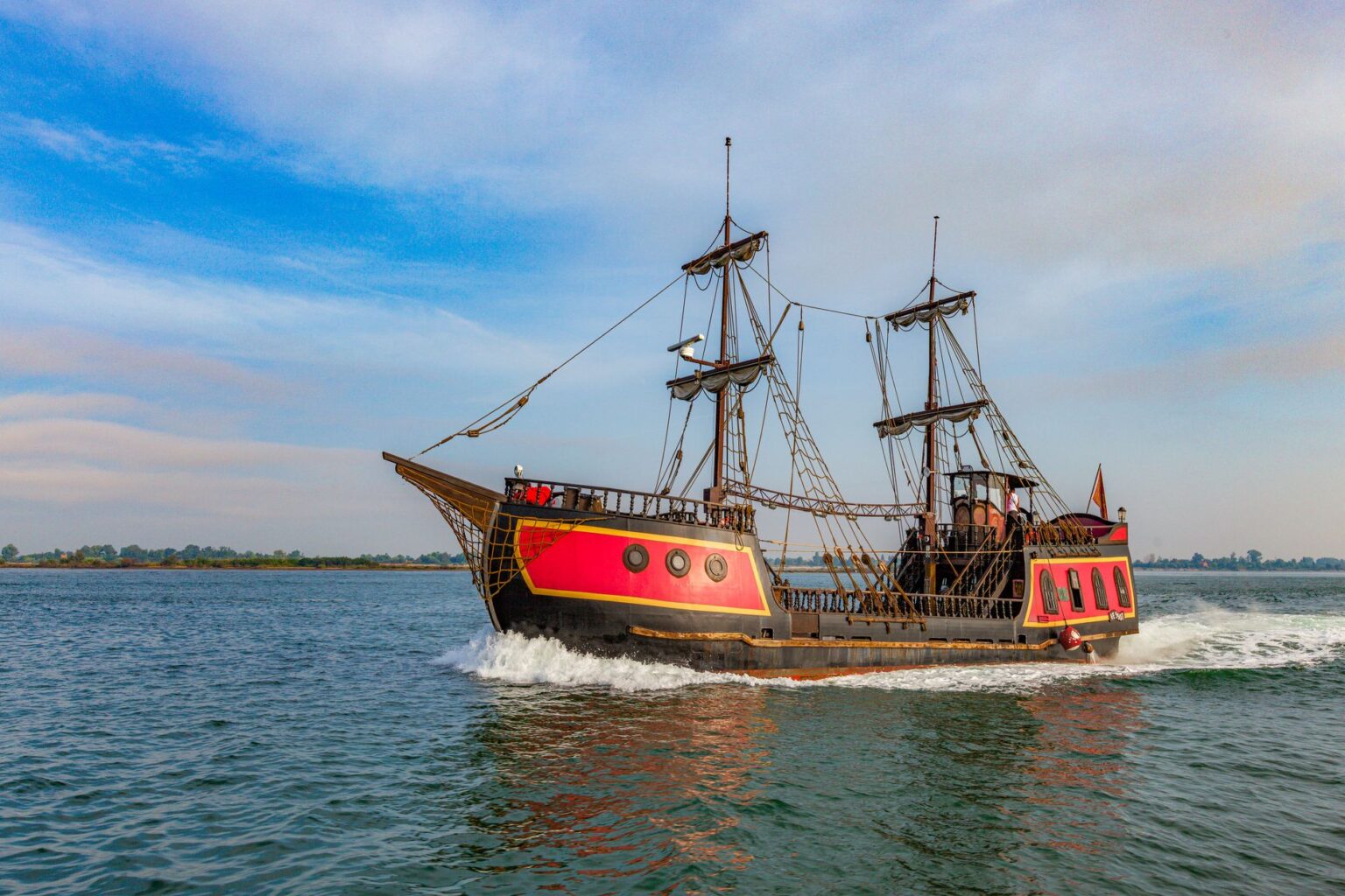 A sailing ship on the open ocean, evoking the naval adventure of Assassin's Creed Black Flag