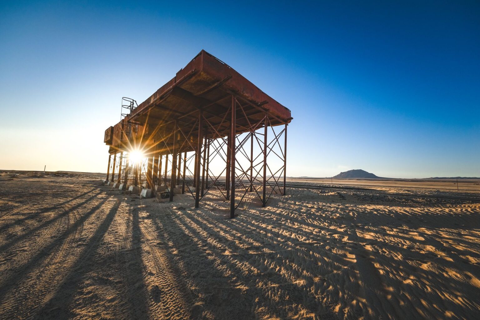 A desolate wasteland scene evoking the post-apocalyptic setting of the Fallout game series