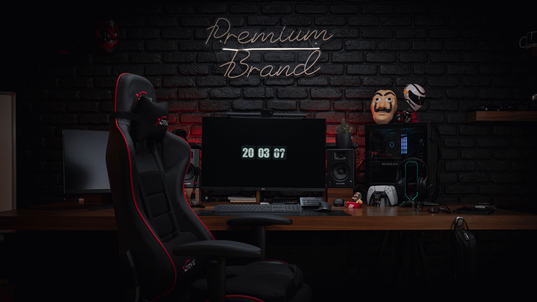 Dark gaming setup with monitor glowing in a dimly lit room