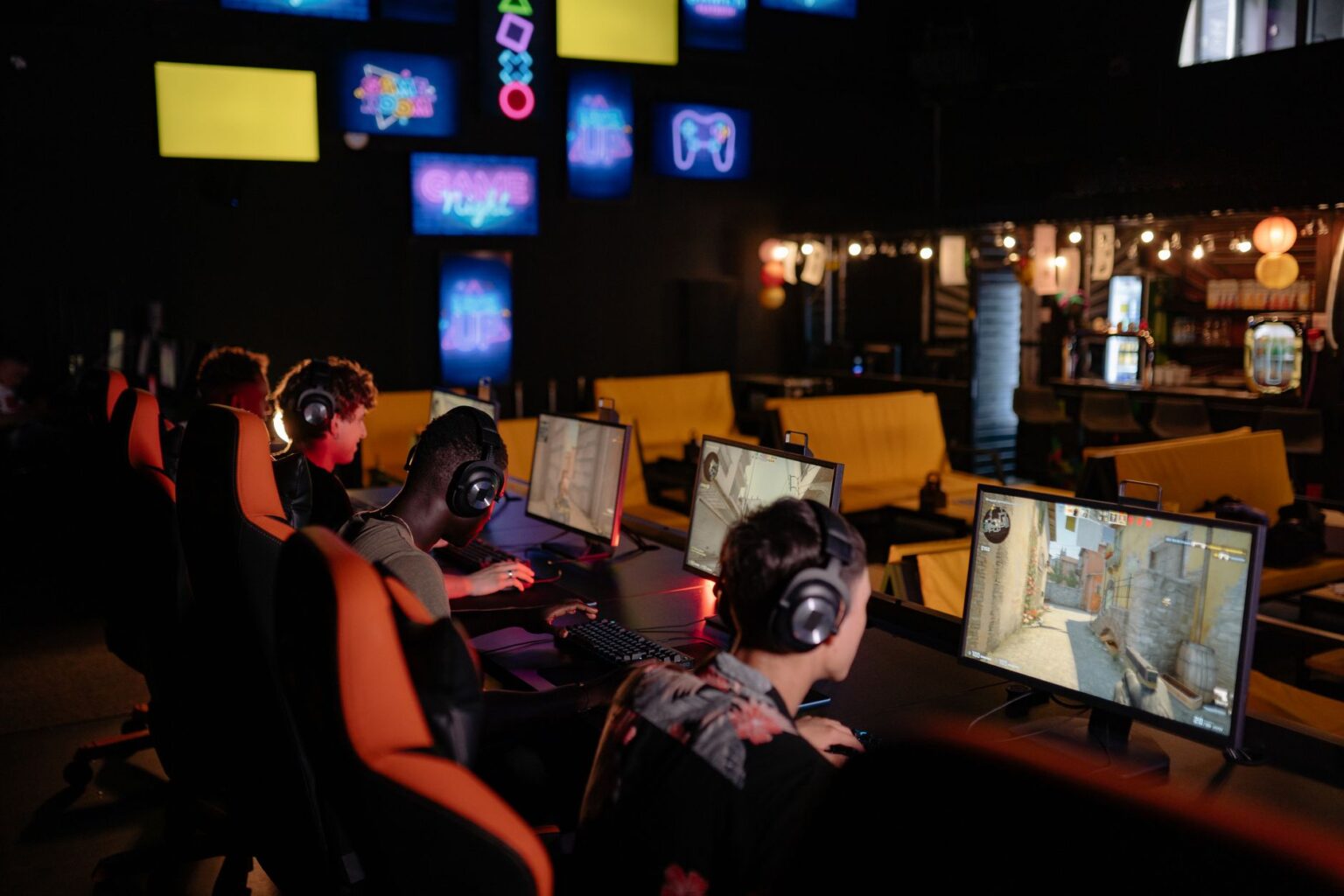 Riot’s Teamfight Tactics Ranked Reset Is Quietly Bleeding Its Core Base Player focused on a competitive strategy game on a monitor at a gaming desk