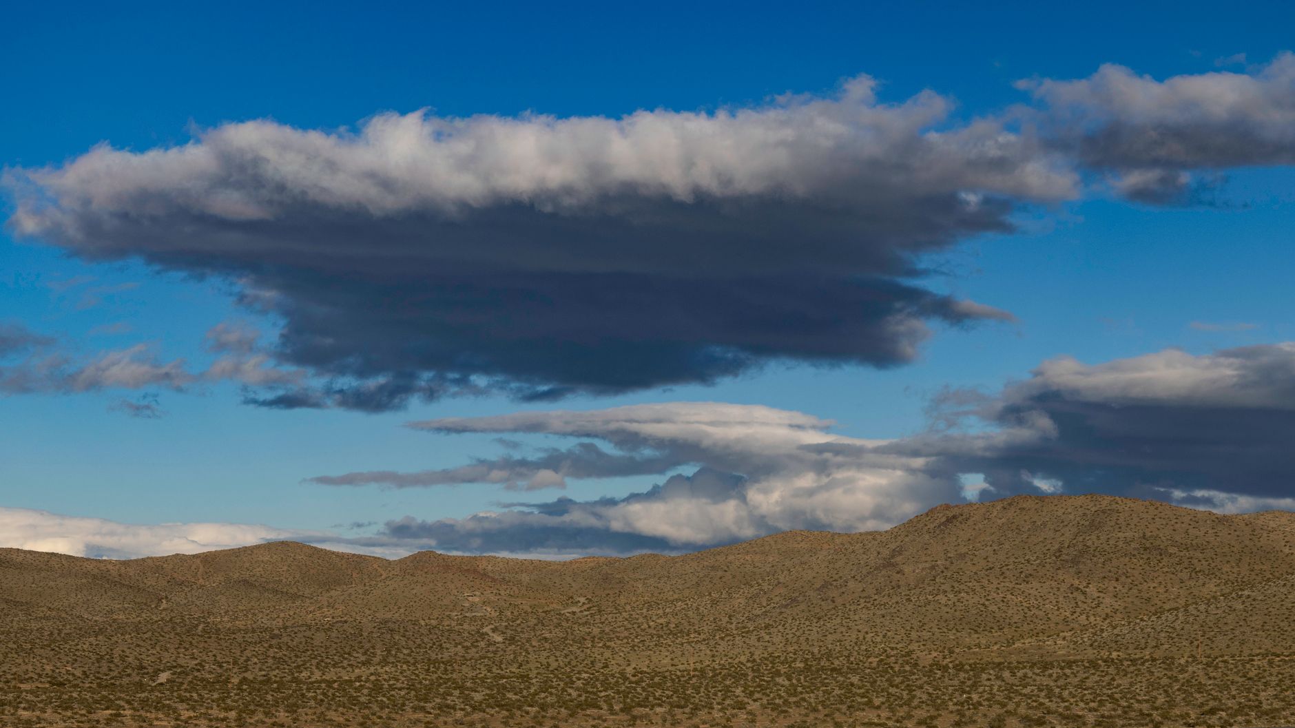 Wide open western desert landscape evoking the setting of Red Dead Redemption 2