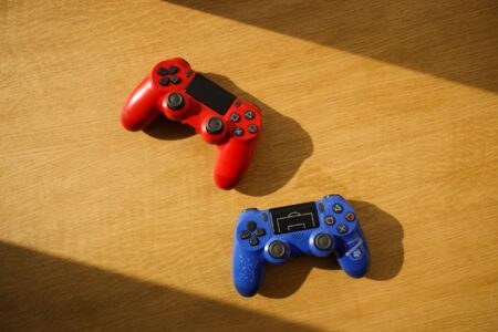 A gaming controller resting on a desk, representing fighting game player frustration with DLC pricing