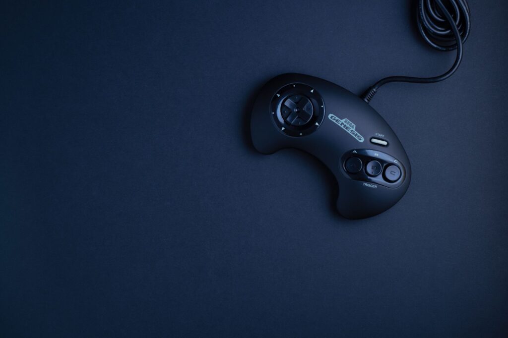 A gaming controller resting on a dark surface, representing competitive multiplayer gaming