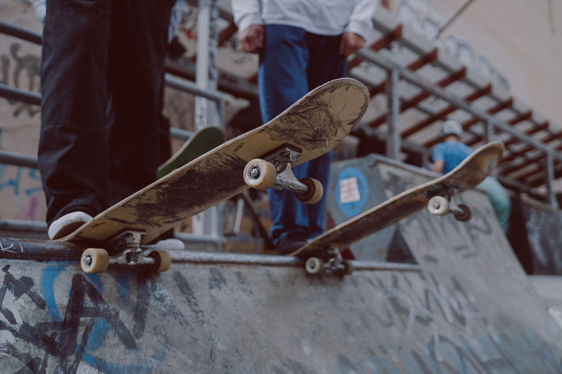 Skateboarder performing a trick on a city street, representing the urban skateboarding culture central to the Skate franchise