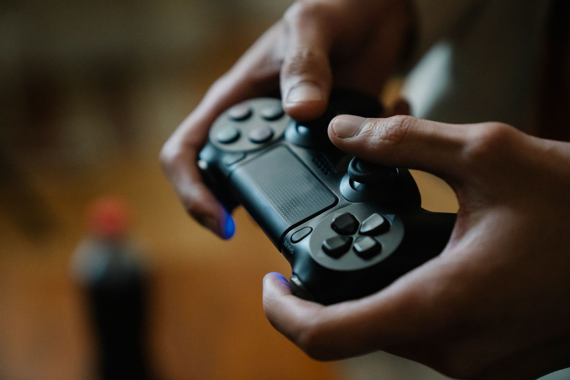 A game controller resting on a dark surface, representing console gaming anticipation