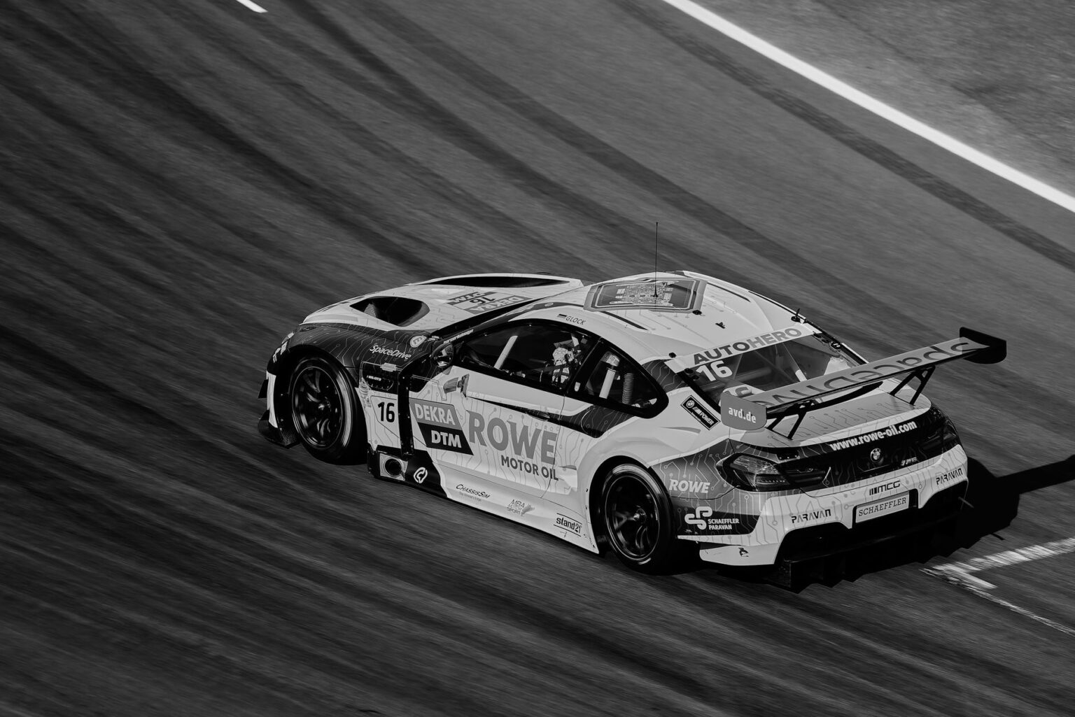 Racing car on a circuit track representing the Grid racing game franchise