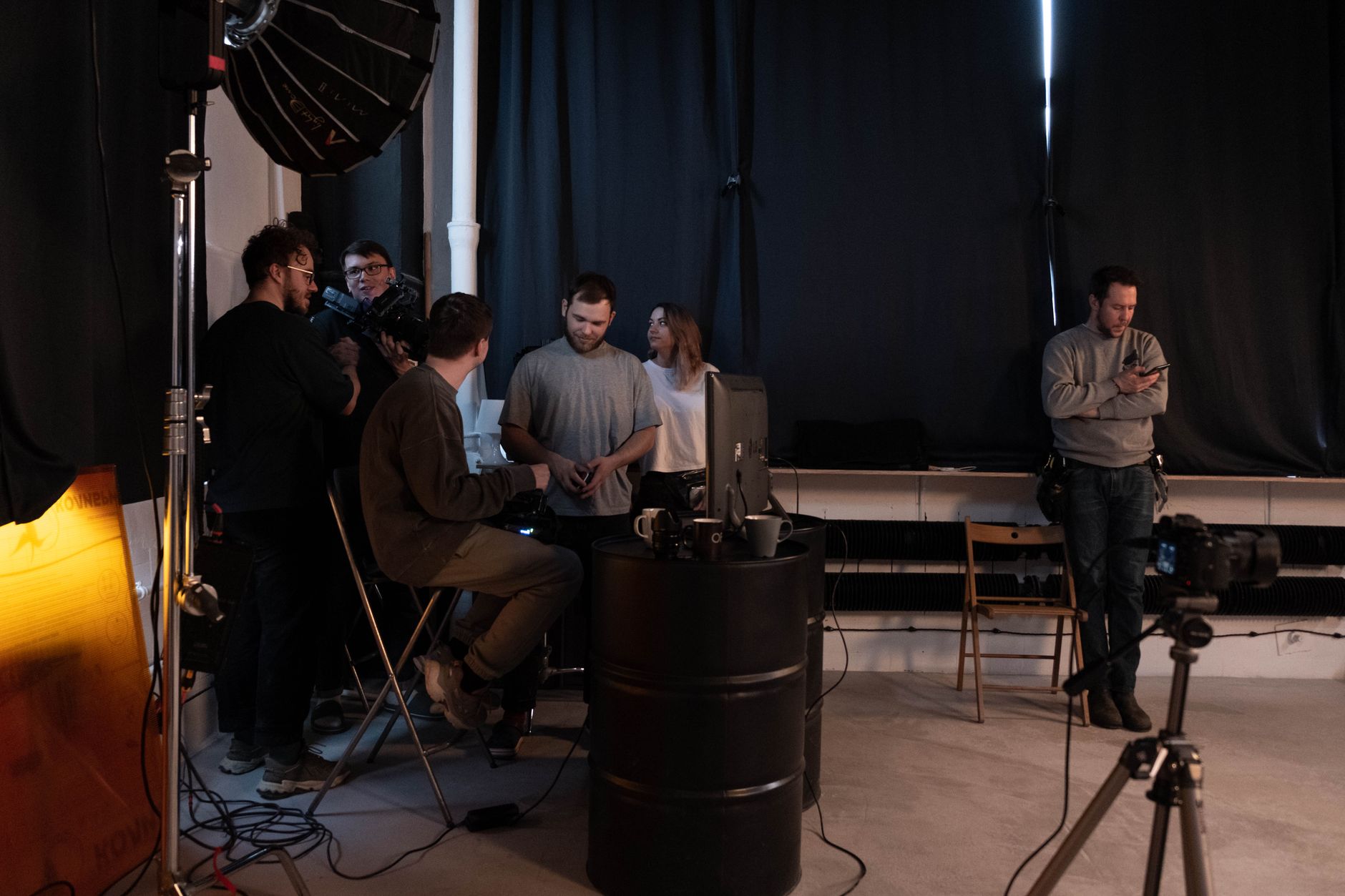 A small development team collaborating around monitors in a game studio environment