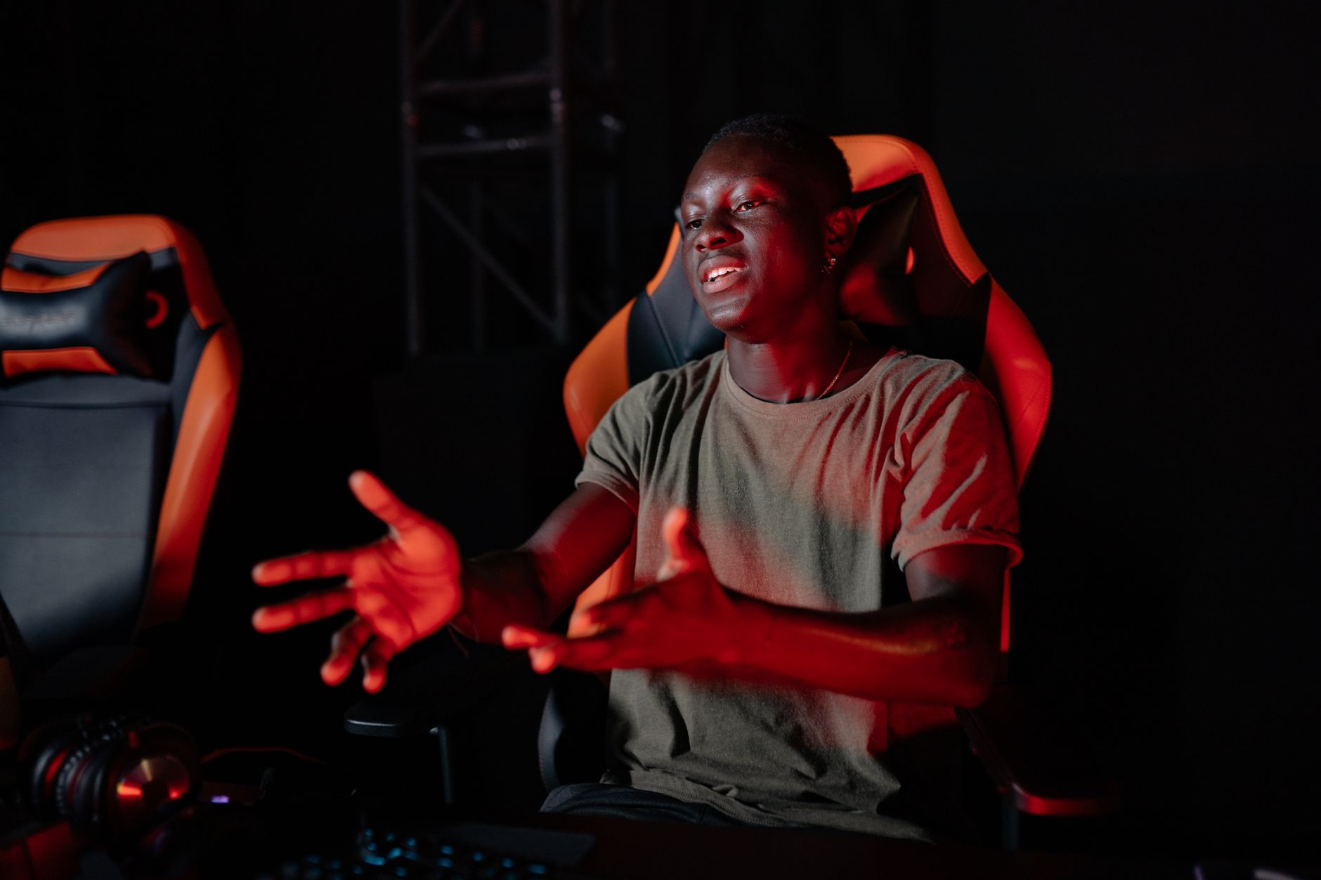 Person sitting at a computer looking frustrated during an online game session