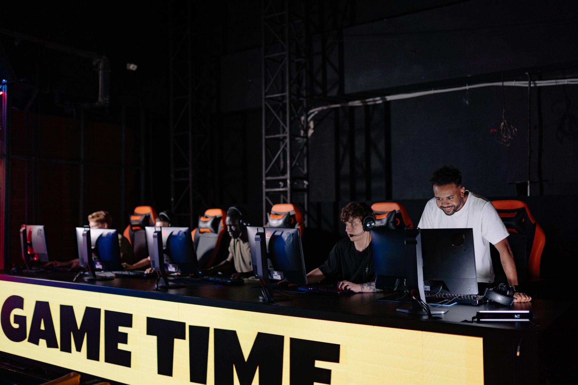 Players gathered around gaming monitors for a co-op session