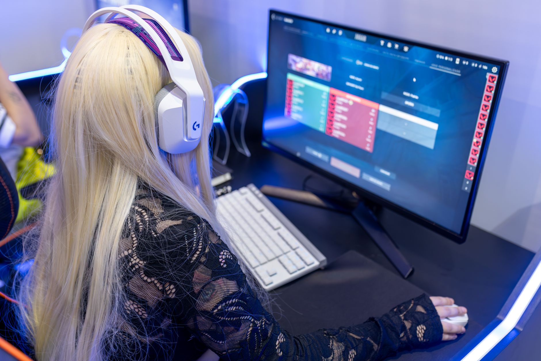 Gaming setup with monitor and keyboard representing online multiplayer progression